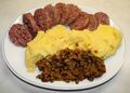 Cotechino served with polenta and lentils