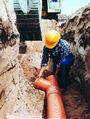 Laying sewer pipes