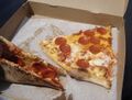 Slices of thin-crust New York–style pizza
